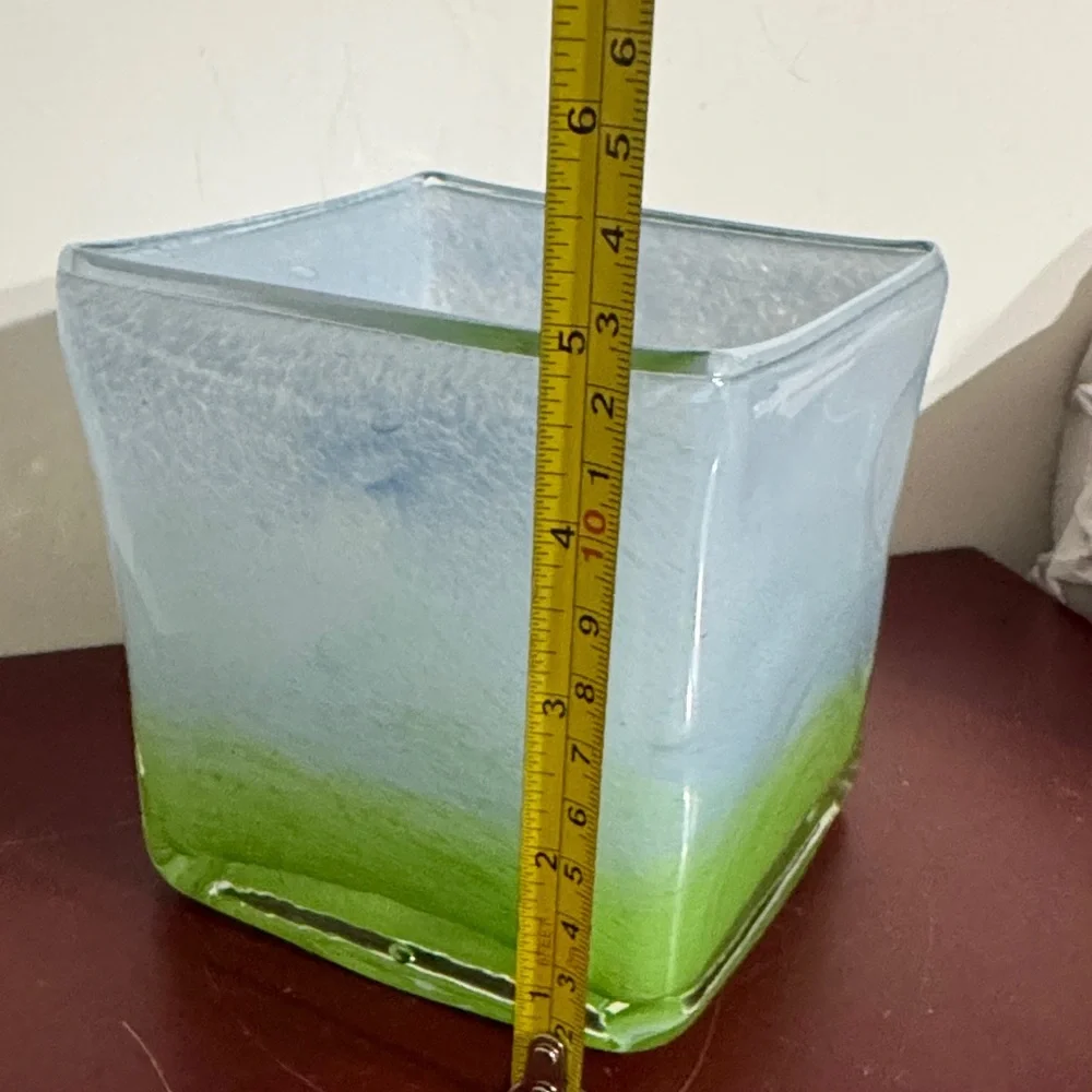 Hand-blown art glass vase with a light blue and green gradient color scheme
